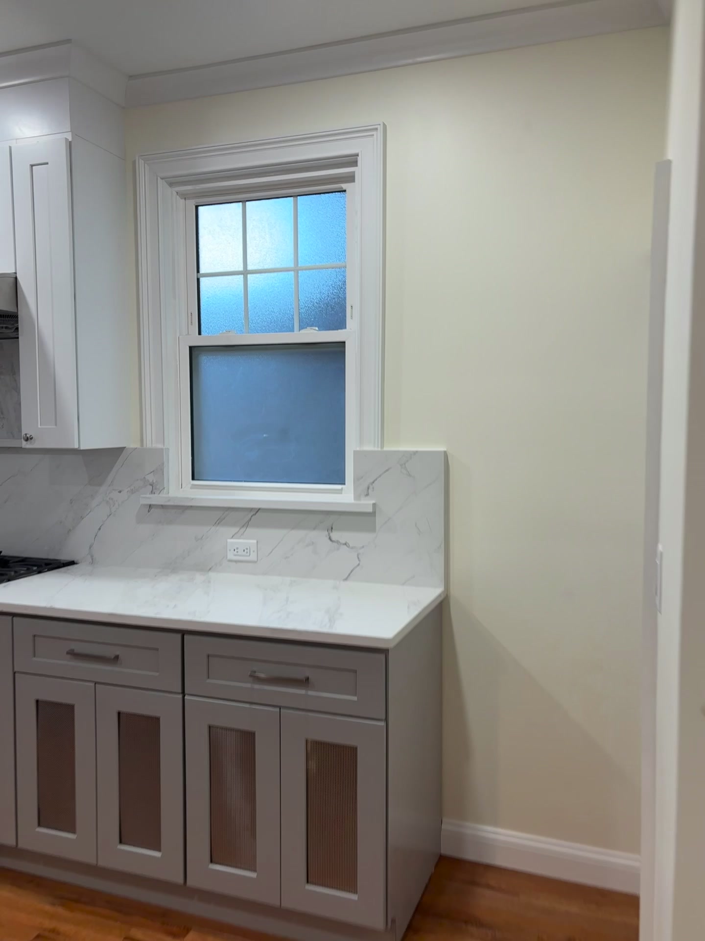 Remodeled Staten Island kitchen with marble countertops and custom shaker cabinetry