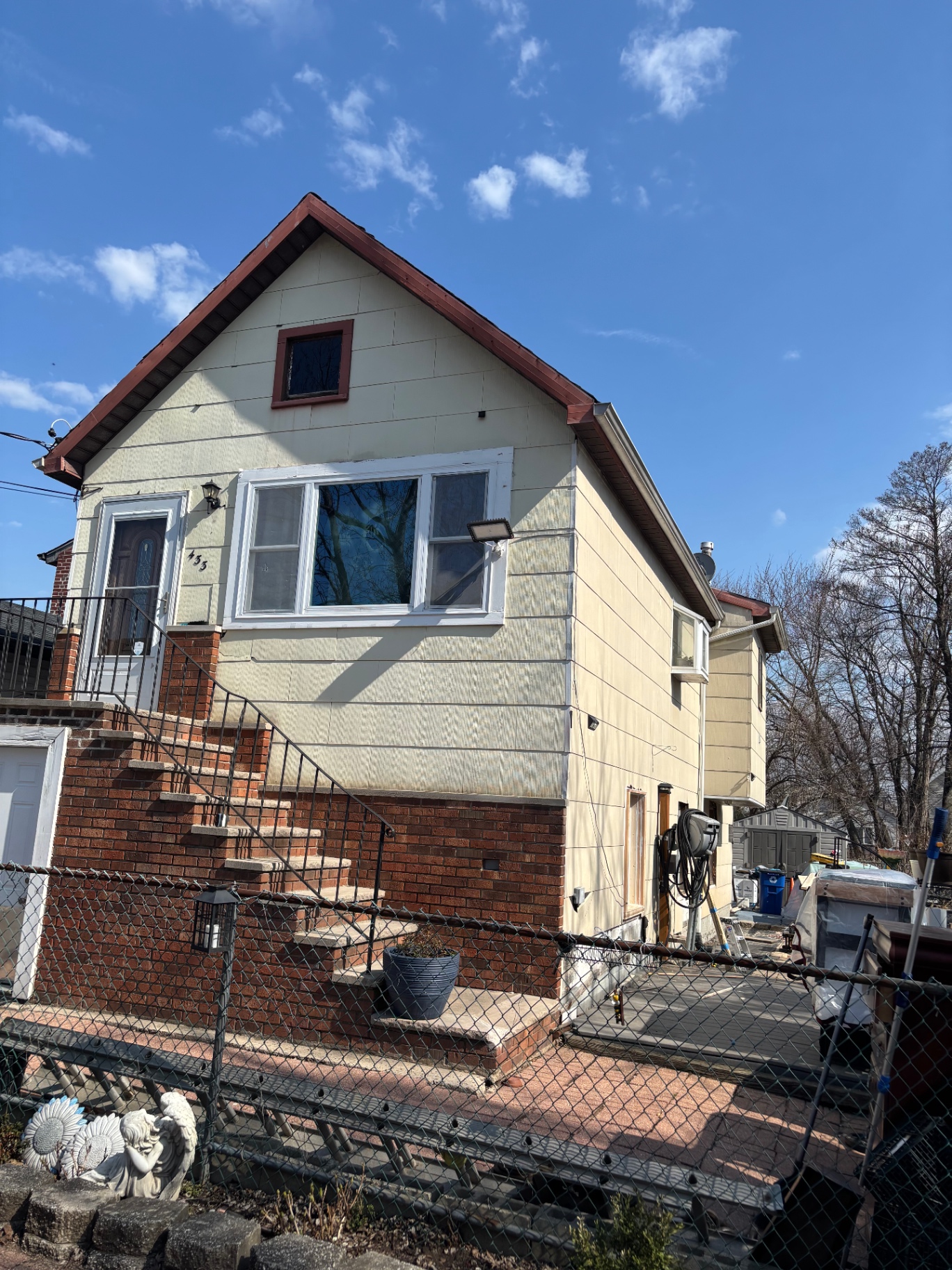 Staten Island home with old faded siding before exterior renovation
